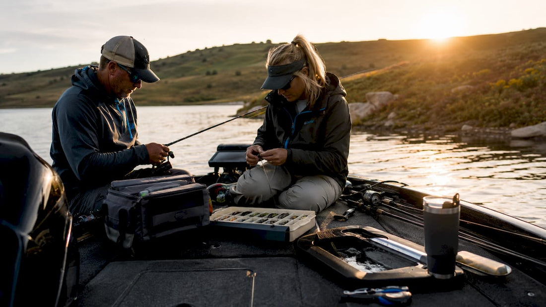 Anglers preparing boat for fishing tournament at sunrise
