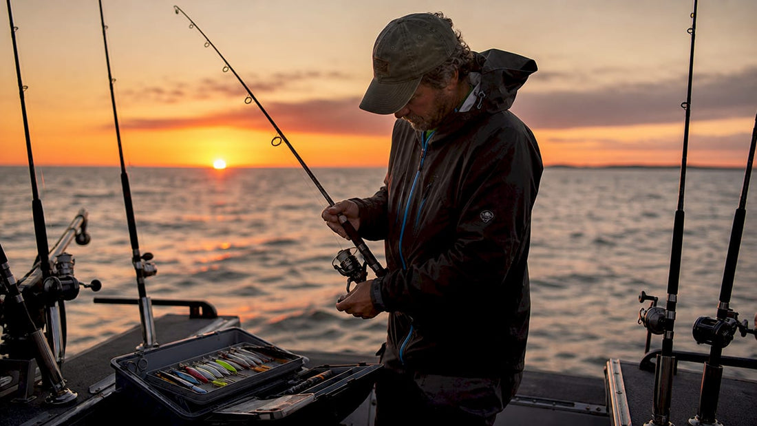 Angler preparing Great Lakes salmon trolling gear on boat