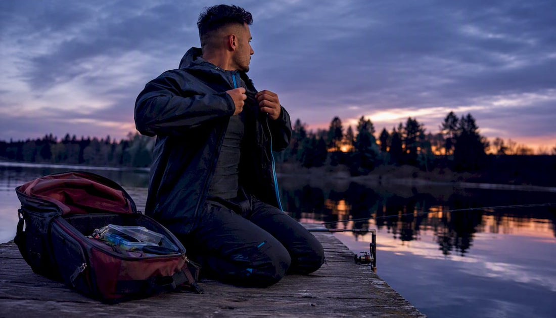 Angler wearing streetwear fishing gear at sunrise shore