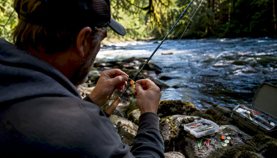 Angler adjusting spinner lure at PNW river